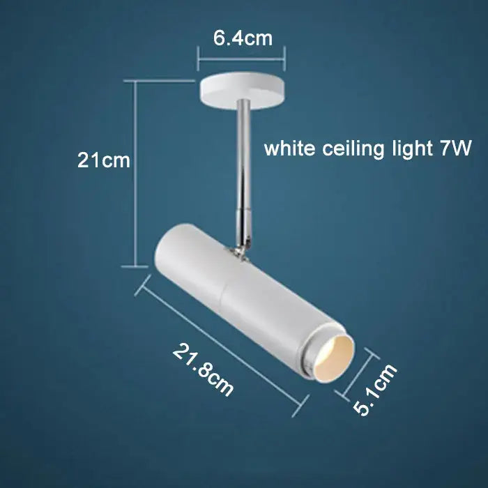 White ceiling-mounted track lights with sleek cylindrical design 7w power featuring decorbites adjustable focus