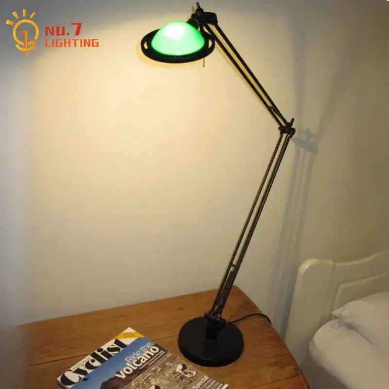 A sleek black decorbites adjustable led desk lamp with a glowing green shade for study or bedroom use
