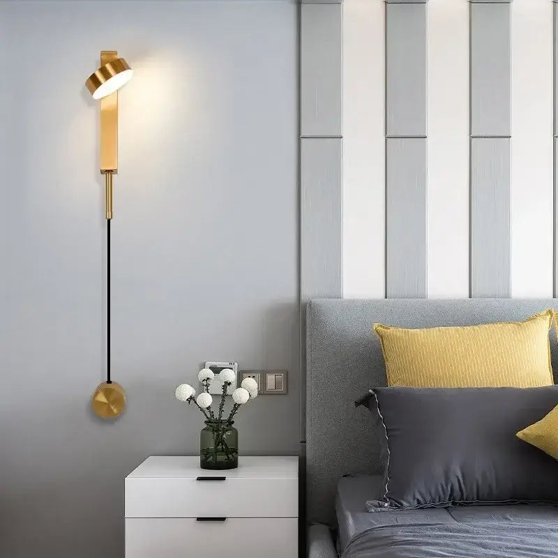Modern black adjustable led wall lamp with gold-toned sleek cylindrical body and spherical base for bedroom decorbites lighting