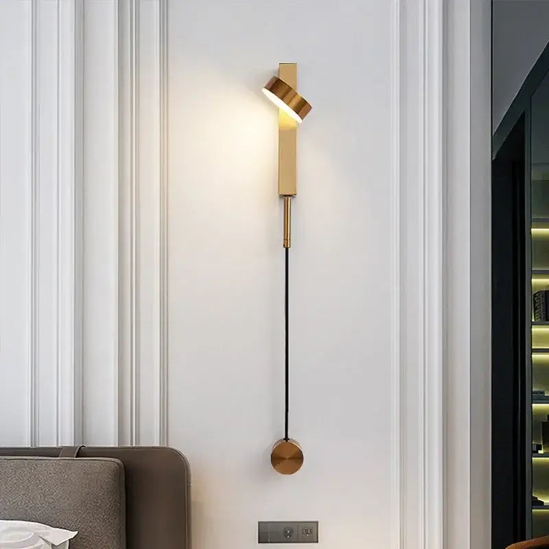 Modern gold-toned wall lamp decorbites adjustable led sconce with sleek twisted design and hanging spherical base