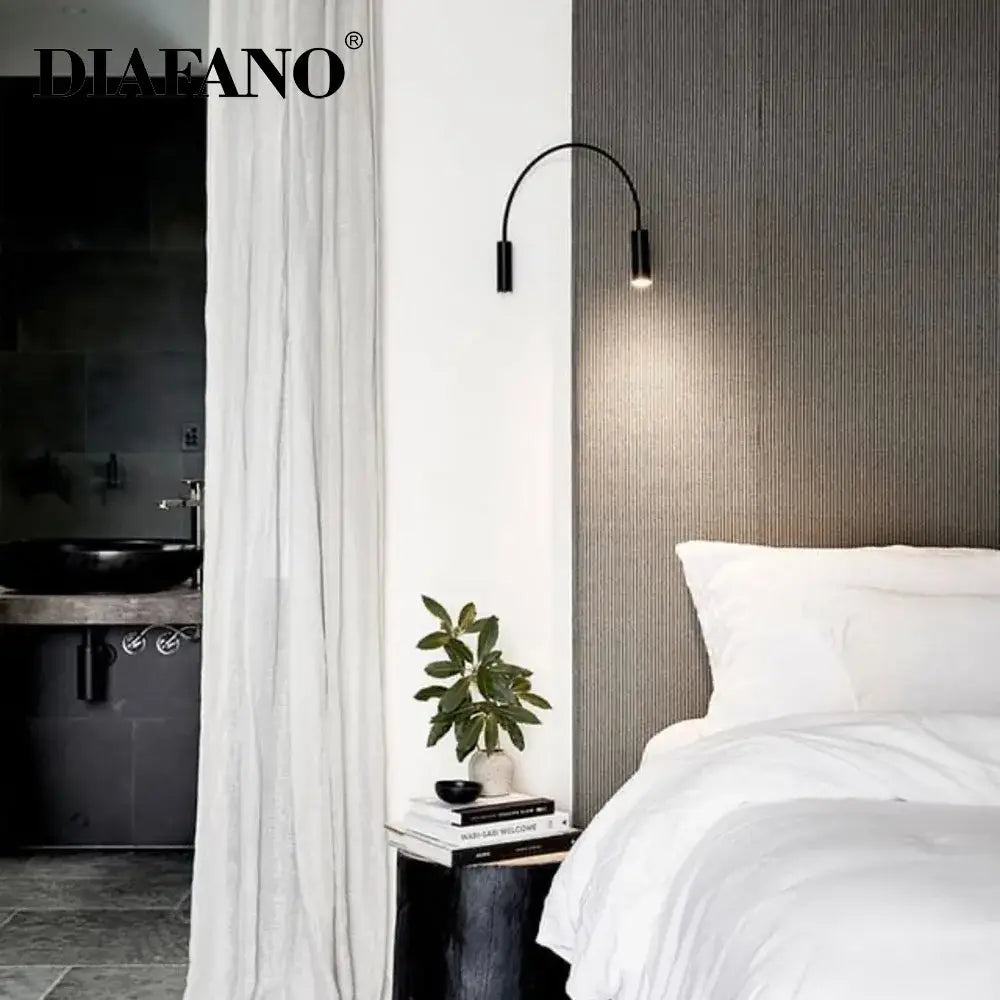 Modern black adjustable rocker wall lamp with curved sleek design emitting warm light ideal for bedroom decorbites adjustable rocker