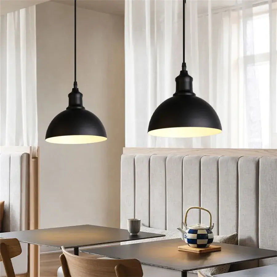 Modern black aluminium pendant light with matte finish and warm glow for dining room decorbites black aluminium decor
