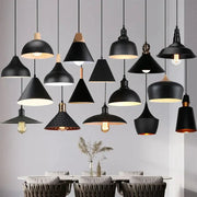 Modern black aluminium pendant light with matte finishes and wooden or brass accents for dining room decorbites decor