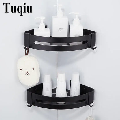 Black aluminum corner shelf with two tiers, slotted shelves, and hooks for bathroom storage by decorbites
