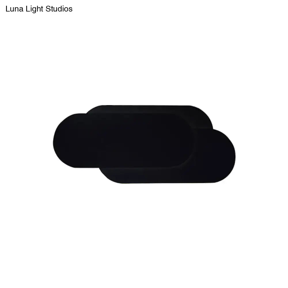 Modern black aluminum oval wall washer lamp featuring a smooth matte finish and cloud-shaped wall sconce design