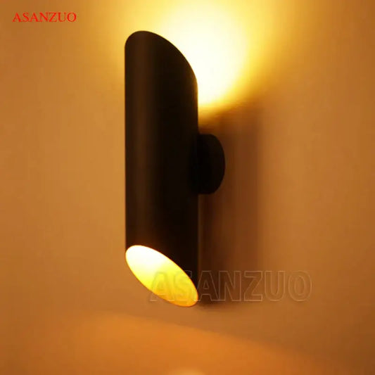 Modern black aluminum tube wall lamp with dual warm-toned led lights for bedroom decorbites black aluminum fixture