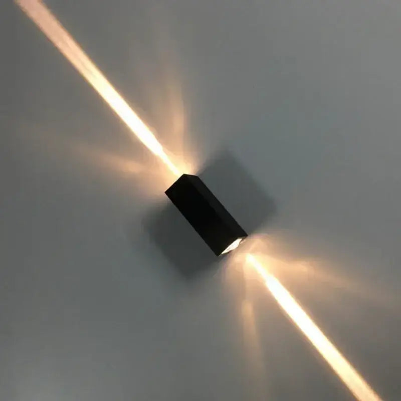 Modern black aluminum waterproof porch spot wall lamp emitting warm focused light beams for living room use