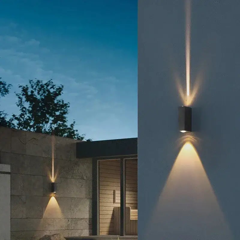 Modern black aluminum waterproof porch wall lamp casting warm focused light as a waterproof porch spot wall lamp