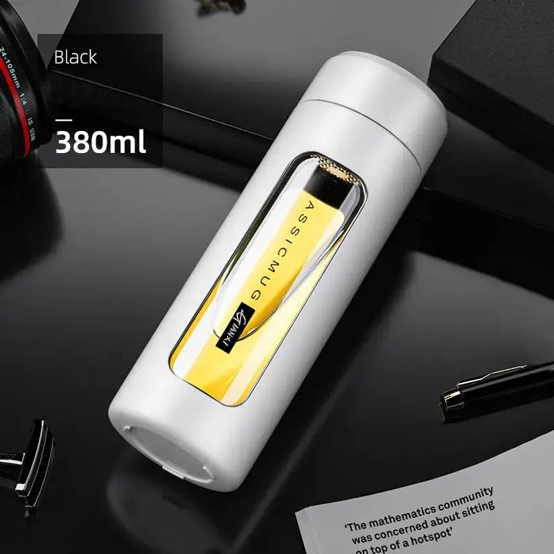 Modern black and amber insulated glass water bottle travel mug with white cylindrical design and transparent window showing glass water inside