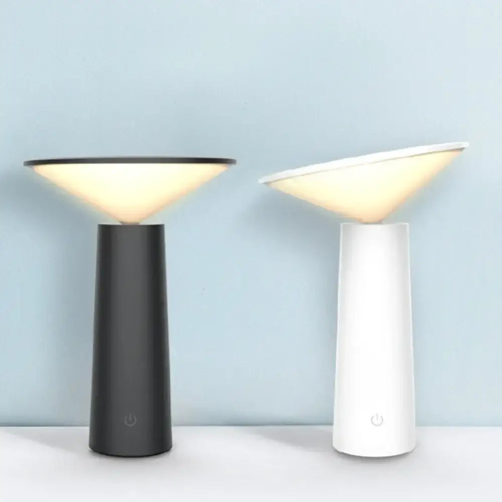 Two modern led usb desk lamps with matte black and beige bases feature touch sensor and softly glowing shades for bedroom use