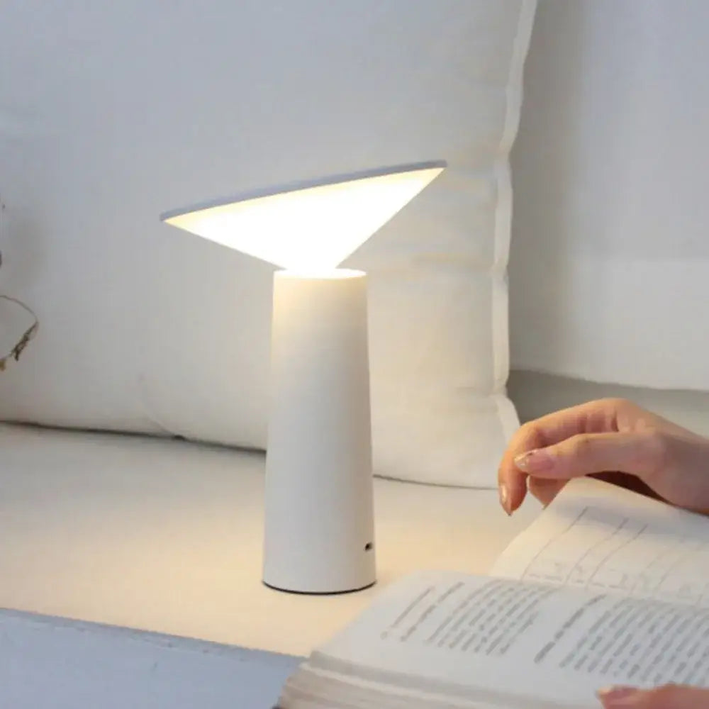 Minimalist white cone-shaped led usb desk lamp with touch sensor and triangular light diffuser for modern bedroom use