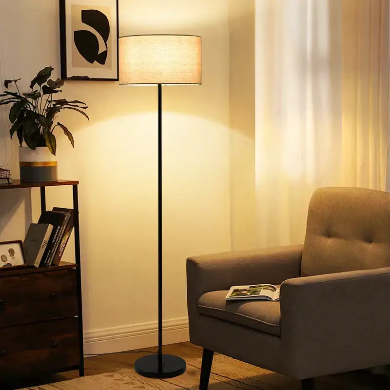 A sleek black and beige led vertical floor lamp with a cylindrical fabric shade for modern living rooms