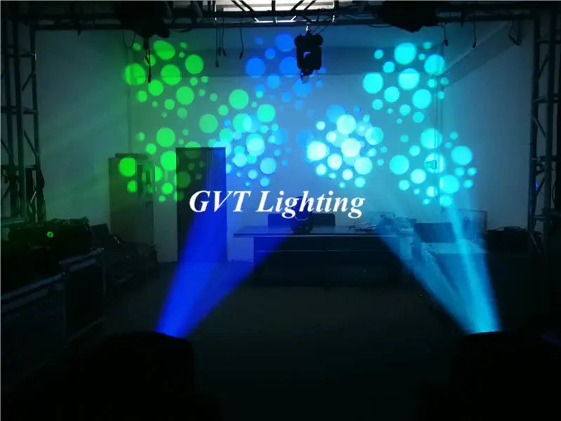 Modern black and blue 200w led moving head light projecting blue and green circular beams for party room use