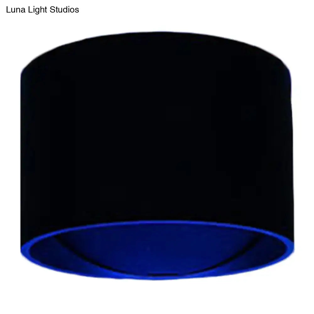 Modern black and blue velvet circle wall light with a black cylindrical lampshade and vibrant blue inner lining for bedroom kit wall lamp