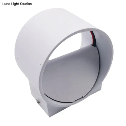 White cylindrical modern wall light with visible wiring included in black and blue velvet wall light kit for bedroom