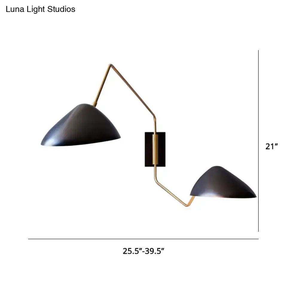 Modern black and brass metal duckbill reading wall light with conical shade and articulated arms for bedroom use