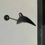 Modern black and brass wall lamp with metallic shade and sleek curved duckbill design for living room fixture height