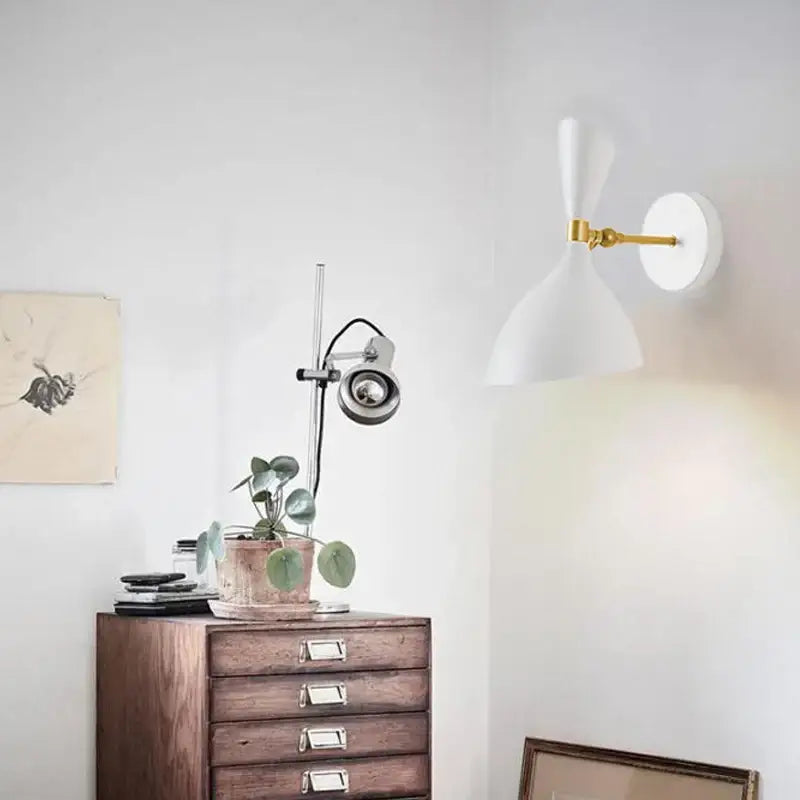 Modern black and brass industrial wall lamp with a white wall sconce and gold articulated arm for living room decorbites black white