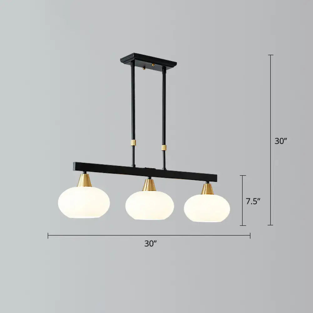 Decorbites minimalist black linear hanging lamp with brass accents and three frosted glass globe shades for dining room island lighting