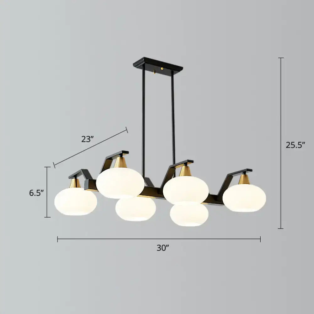Modern black linear hanging lamp with brass frame and five frosted opal glass shades for dining room island lighting