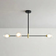 Modern black and brass metal island pendant chandelier with three clear glass globes and adjustable chain cord length