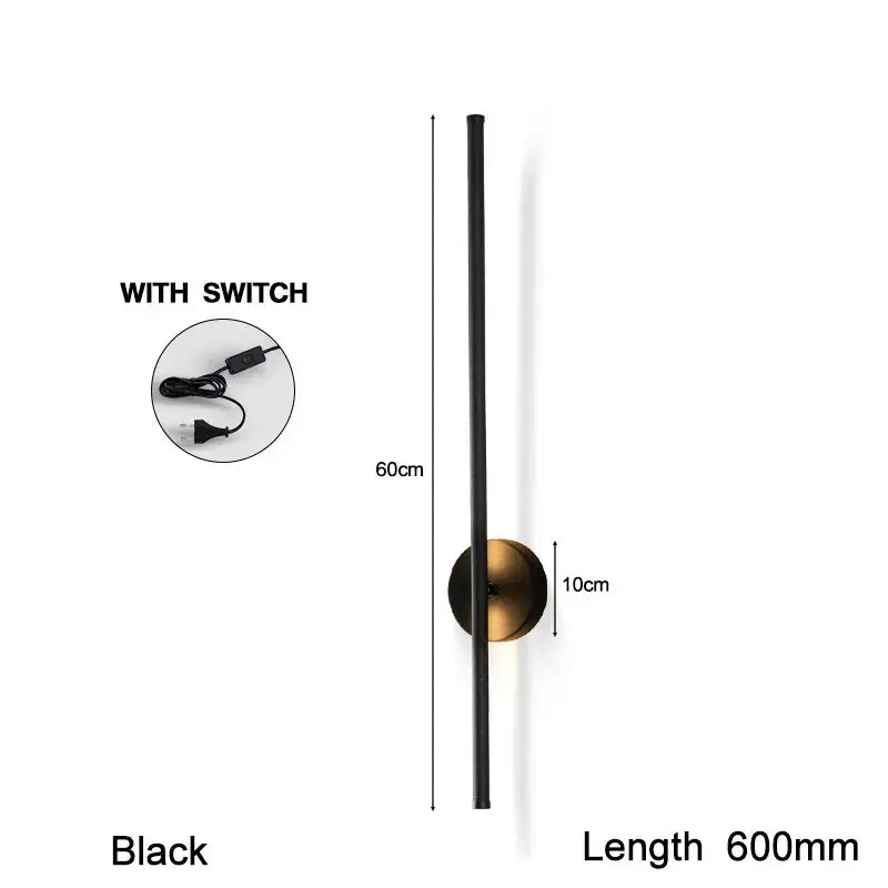Modern black and brass rotation led wall light featuring a sleek cylindrical design and antique brass circular base