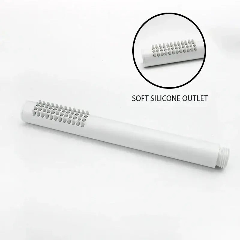 Modern black and brushed golden handheld shower head with white cylindrical silicone outlet and soft rounded bristles