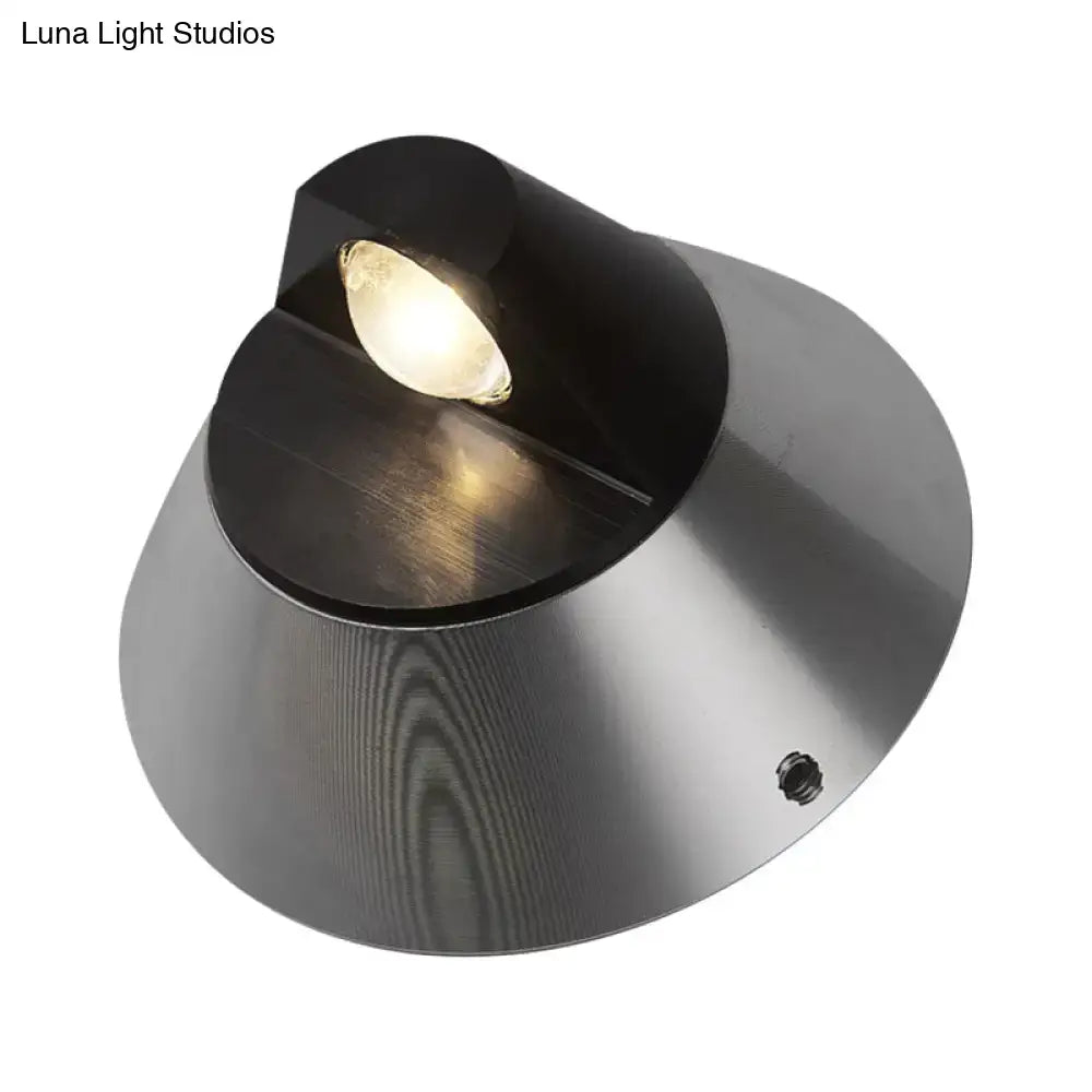 Modern black and brushed steel conical wall light spotlight designed as a sleek outdoor corridor sconce
