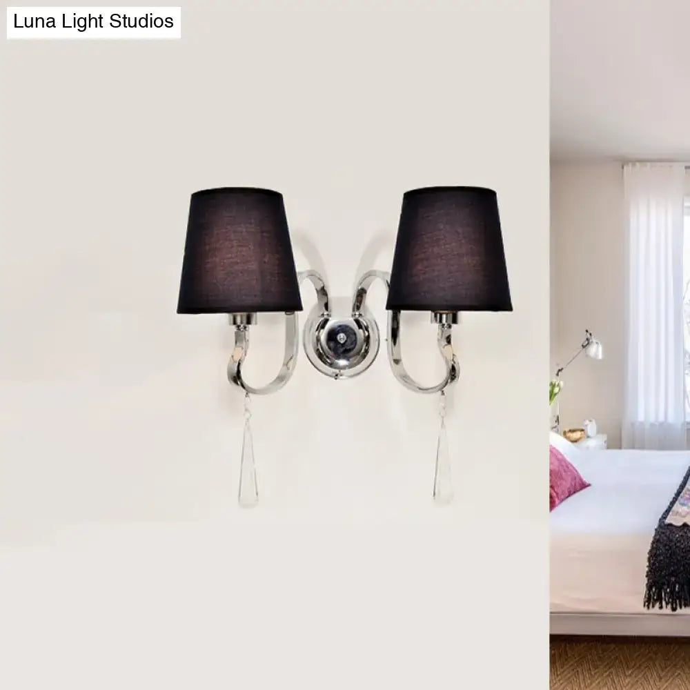 Modern black and chrome crystal wall mount light with double-arm design, black fabric shades, and crystal teardrop accents