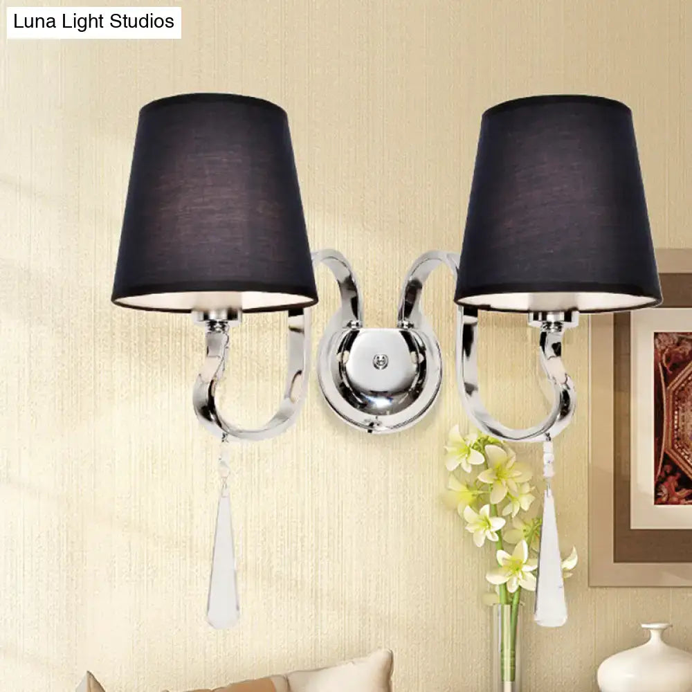 Modern black and chrome wall mount light with two fabric shades and crystal teardrop pendants for bedroom use