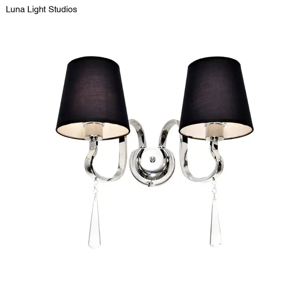 Modern black and chrome wall mount light with double-arm design, fabric shades, and crystal teardrop pendants for bedroom