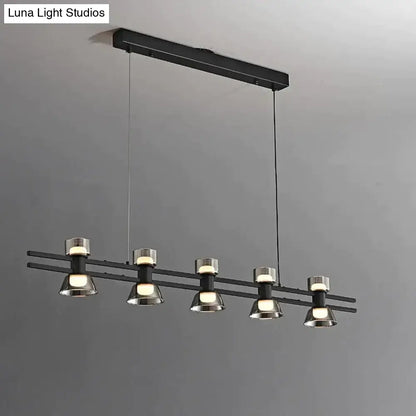 Modern black and chrome linear led strip lamp with five cylindrical metal fixtures for kitchen island lighting