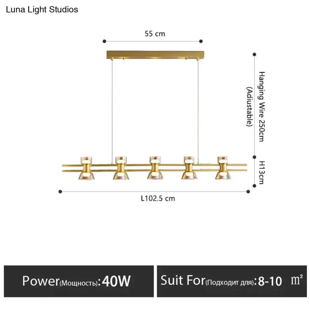 Modern black and chrome led strip lamp featuring a gold-toned linear pendant with five clear glass bulbs for kitchen island lighting