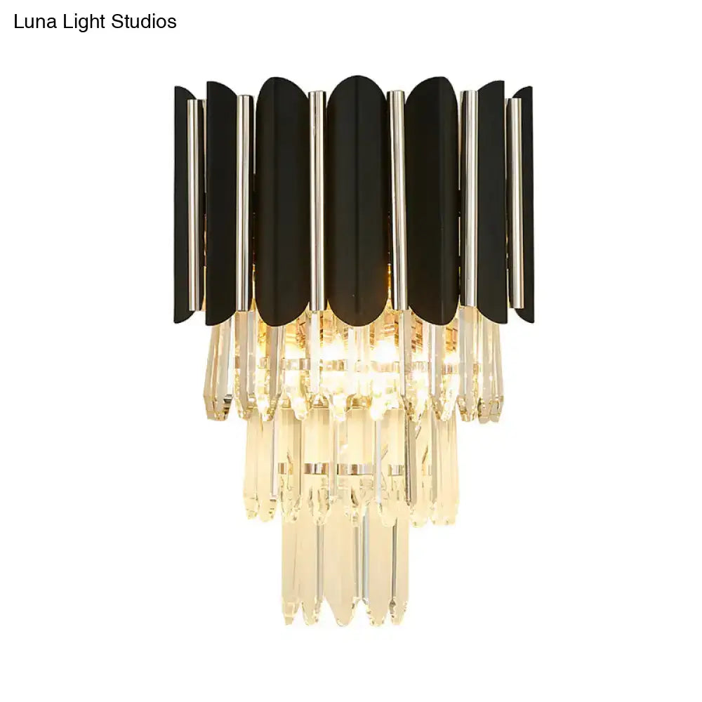 Modern black and silver wall sconce with clear crystal cascading droplets for bedroom tiered lighting