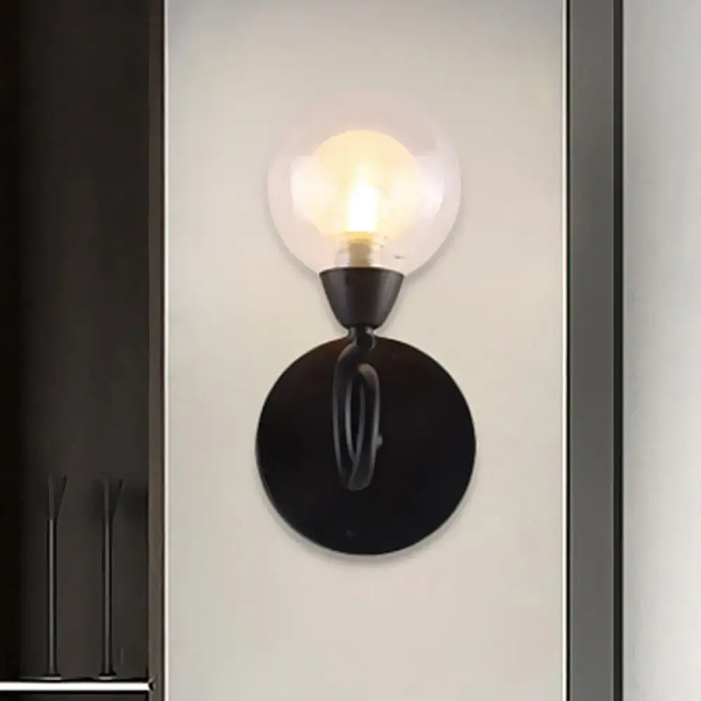 Modern black wrought iron wall lamp with clear glass globe light fixture for living room illumination
