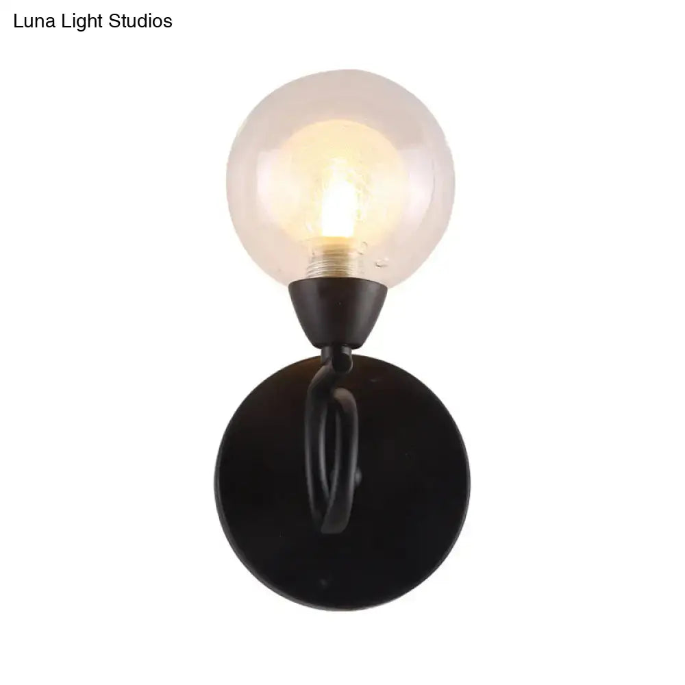 Black wrought iron wall lamp with frosted glass globe light fixture for modern living room lighting