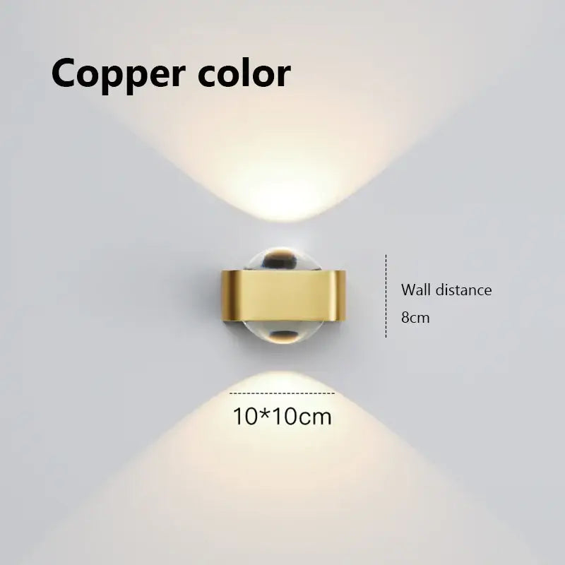 Modern black and copper bedroom wall lamp featuring a copper bedroom wall spotlight with a sleek rectangular metallic body and glass dome lens