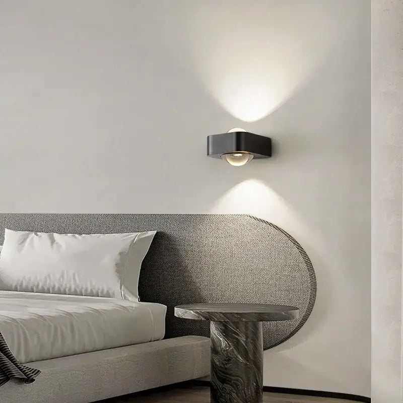 Modern black and copper bedroom wall lamp with frosted glass dome emitting warm light ideal for decorbites copper bedroom decor