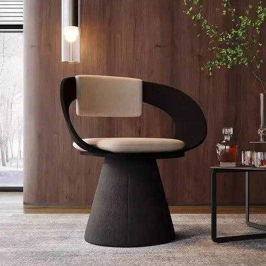 Modern black and cream elegant rotating chair with a sleek curved frame and upholstered seat for bedroom makeup use