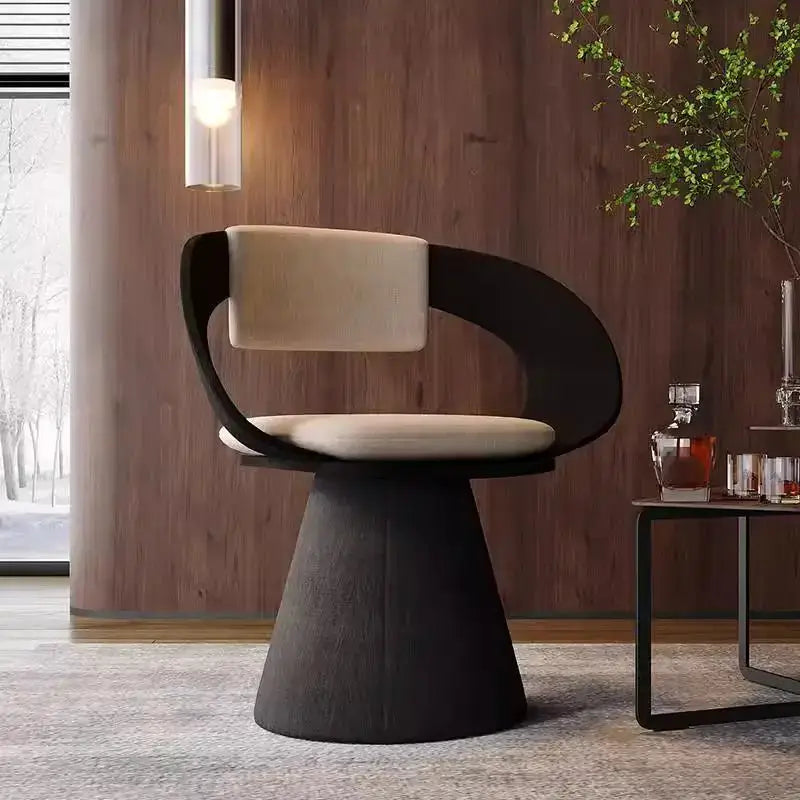Modern black and cream elegant rotating chair with a sleek curved frame and upholstered seat for bedroom makeup use
