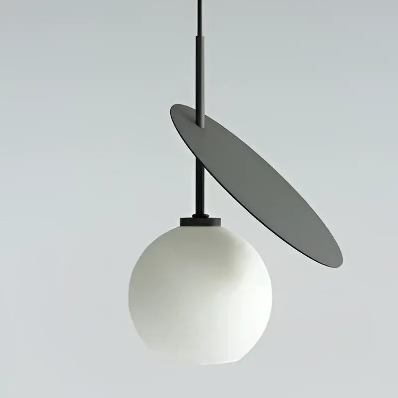 Modern black and crimson glass cherry pendant light with matte white globe and angular gray disc for dining room decorbites glass cherry