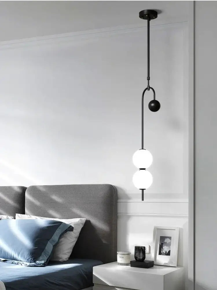 Modern black and frosted glass suspension kitchen ceiling pendant with two spherical bulbs and curved metal arm decorbites glass suspension