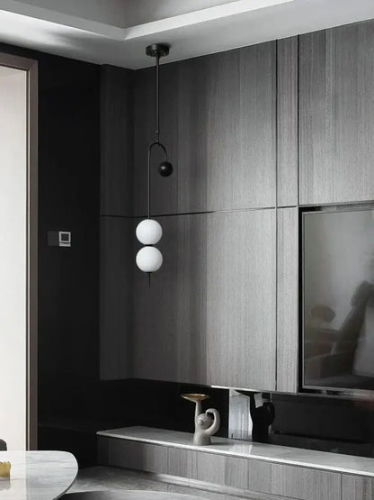 Modern black and frosted glass suspension kitchen ceiling pendant with two white spherical globes and black metal arm chain decorbites glass suspension