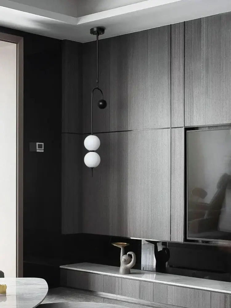 Modern black and frosted glass suspension kitchen ceiling pendant with two white spherical globes and black metal arm chain decorbites glass suspension