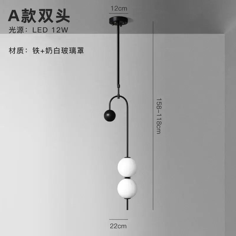 Modern black and frosted glass suspension kitchen ceiling pendant with curved stem and two spherical led shades decorbites glass suspension
