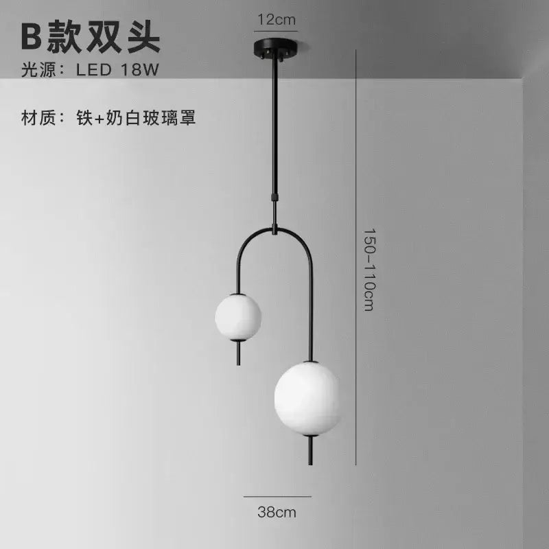 Modern black and frosted glass suspension kitchen ceiling pendant with milk-white spherical shades by decorbites glass suspension