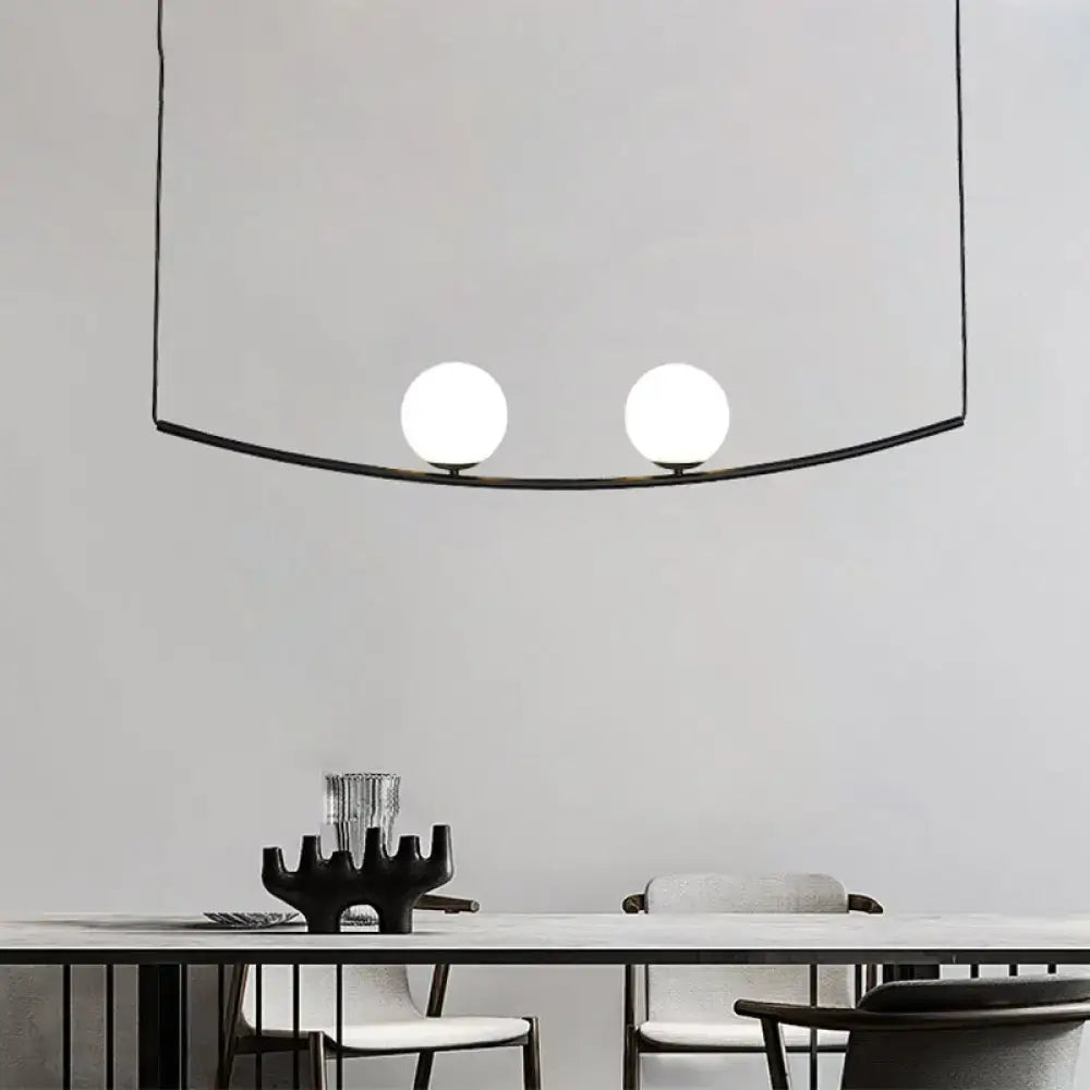 Modern black metal pendant light featuring two frosted glass bulbs from decorbites black gold bubble island light