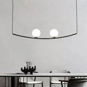 Modern black metal pendant light featuring two frosted glass bulbs from decorbites black gold bubble island light