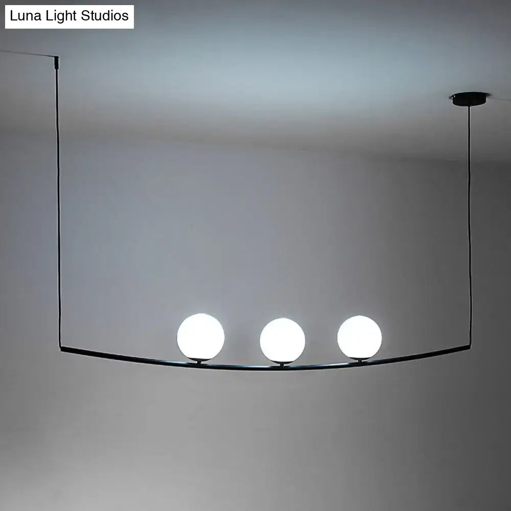 Decorbites modern metal chandelier with black gold finish and three light bubble island glowing white bulbs