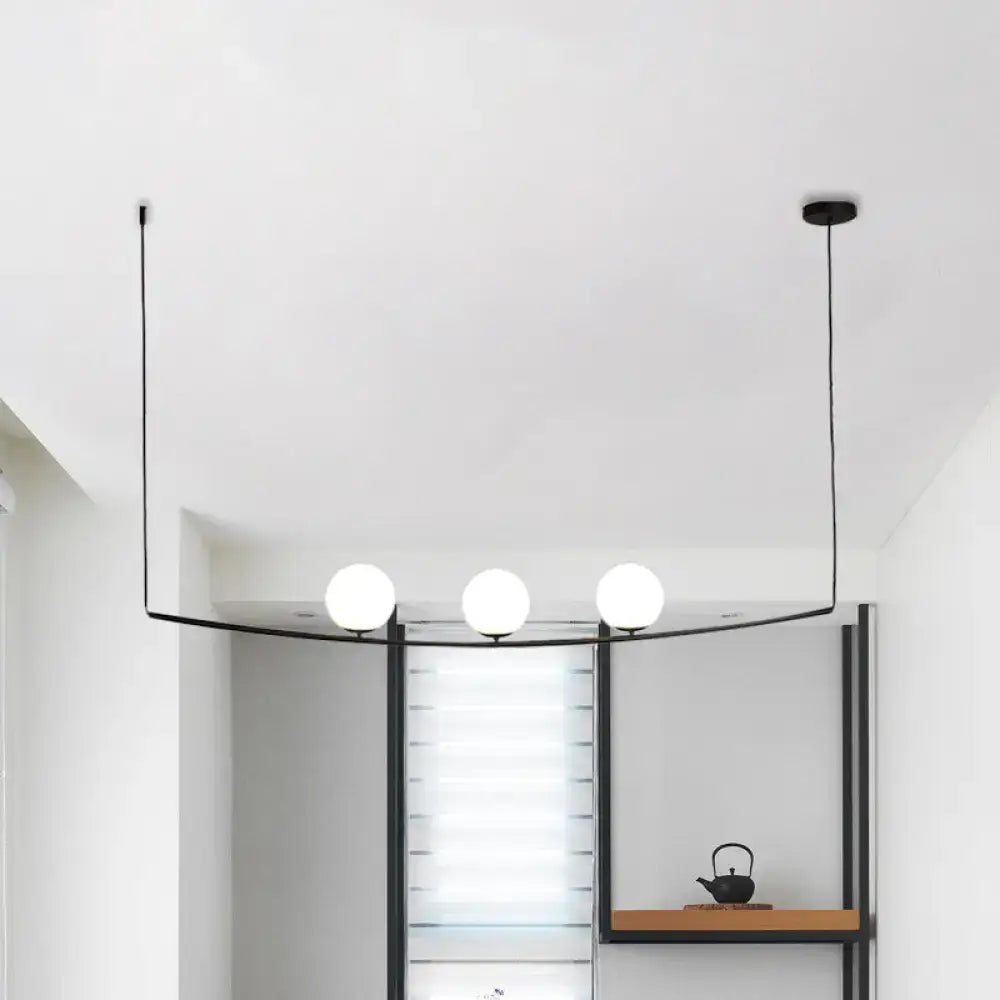 Modern black metal pendant light with three white glass bulbs from decorbites™ black gold bubble island light collection